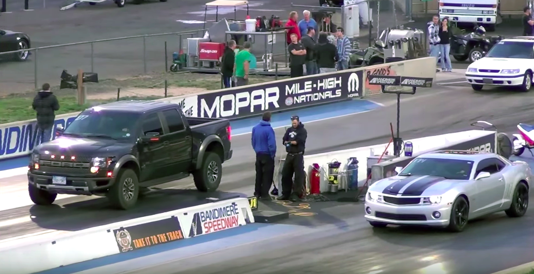 Watch a Ford Raptor take on a Camaro SS