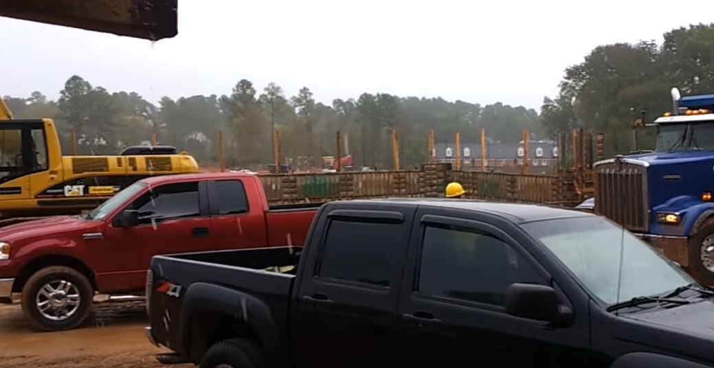 Ford F-150 liberates dump truck from a muddy fate