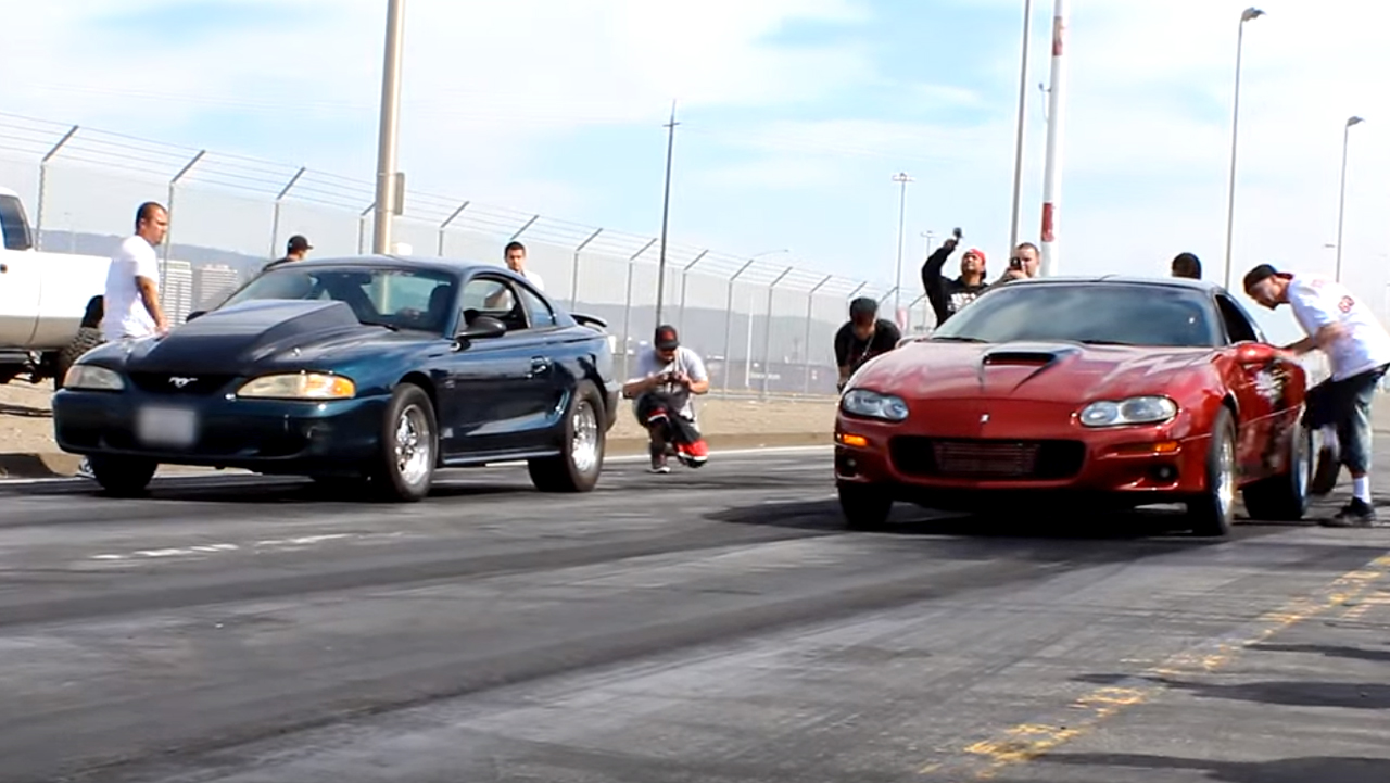 Supercharged Mustang SN95 takes on Camaro SS